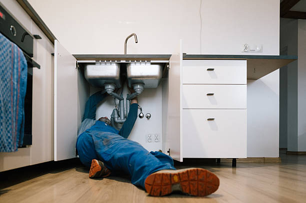 Professional Drain Cleaning technician working in Ozark, AR